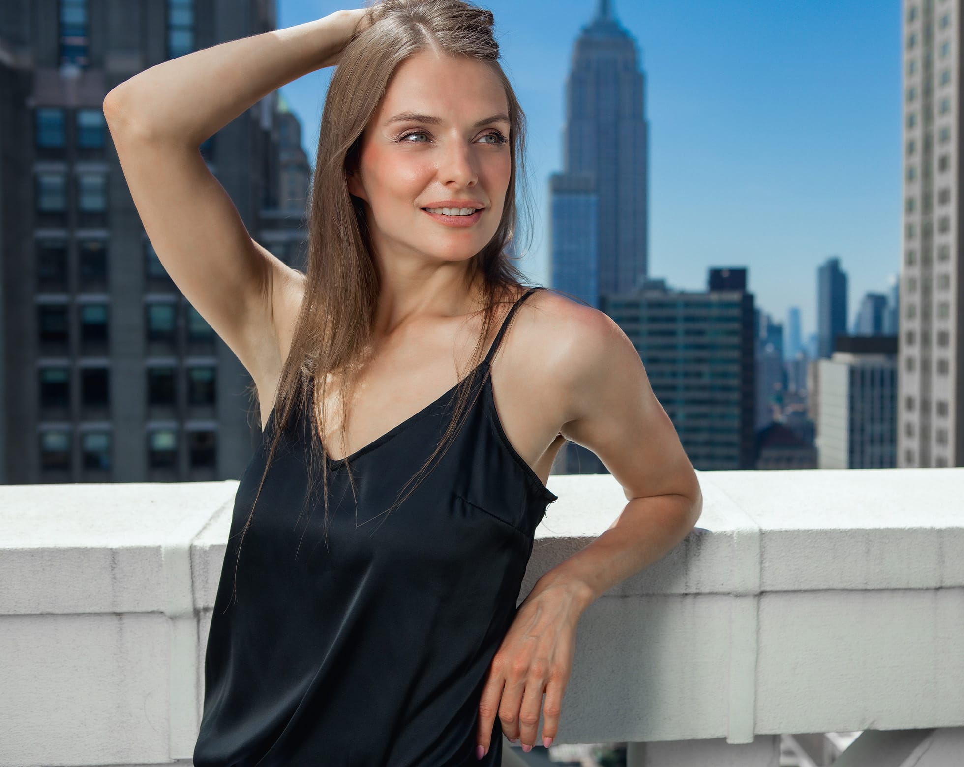 Woman smiling on a balcony