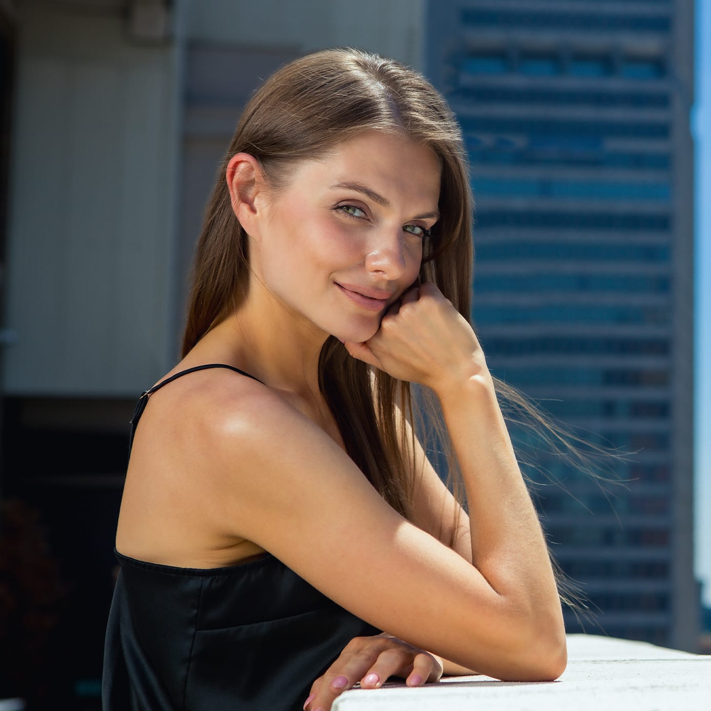 Woman smiling on a balcony