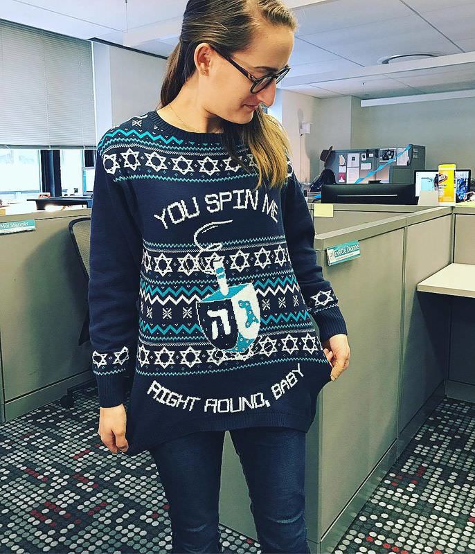 woman wearing a hanukkah sweater